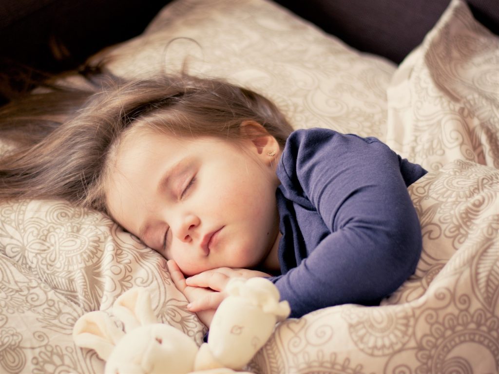 Toddler sleeping alone.